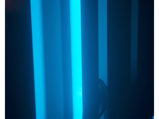 Abstract representation of techno rhythms with dark, industrial tones and pulsating lights.