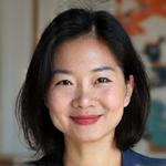 Professional headshot of Dr. Lyra Chen, a cultural critic and sociologist, with a wise and observant expression.